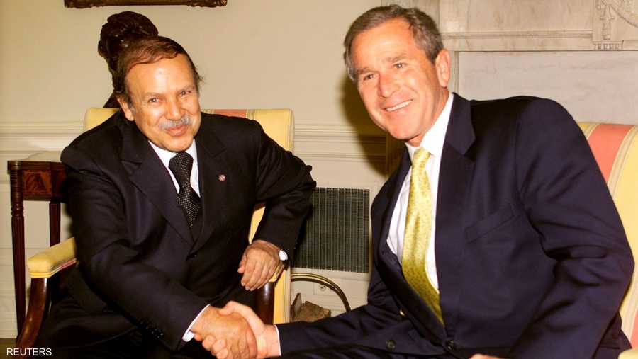 مع الرئيس الأميركي السابق جورج بوش الابن