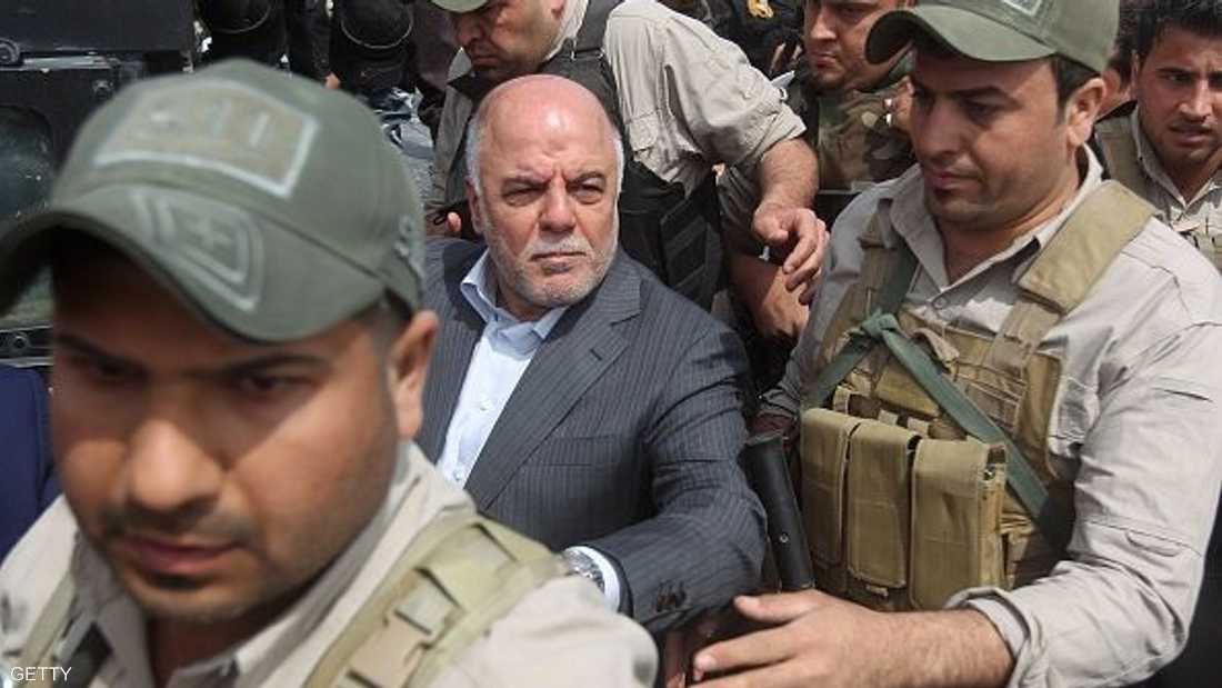 An Iraqi force is holding Abadi and his wife 1-1213513